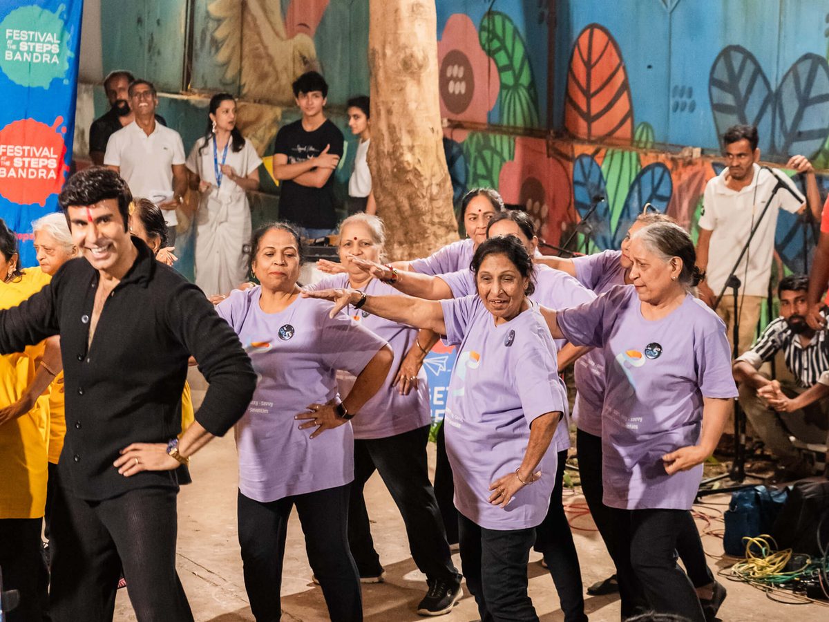 Senior citizens dancing together with an instructor