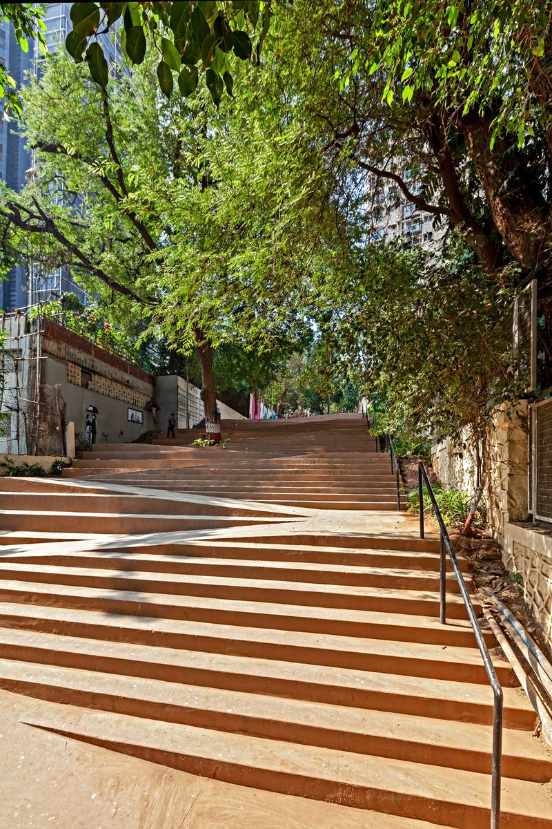 The zigzag steps climbing up Mount Mary under a canopy of trees